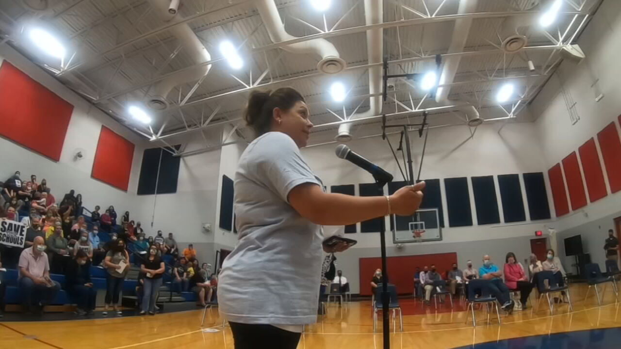 Nicole Milburn speaks during a community meeting at Bloomfield Elementary